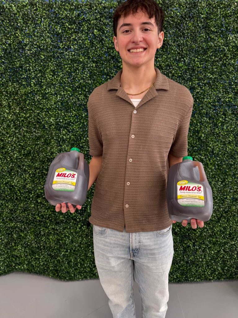 Milo's Unsweet Gallons in hands of a male